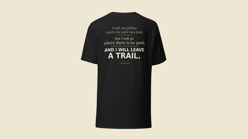 Leave a Trail — Muriel Strode quote tee, back print on black. Her name on her words. Quoteiac.