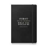 Black hardcover journal, front: “First say to yourself what you would be.” Epictetus, in Roman capitals.