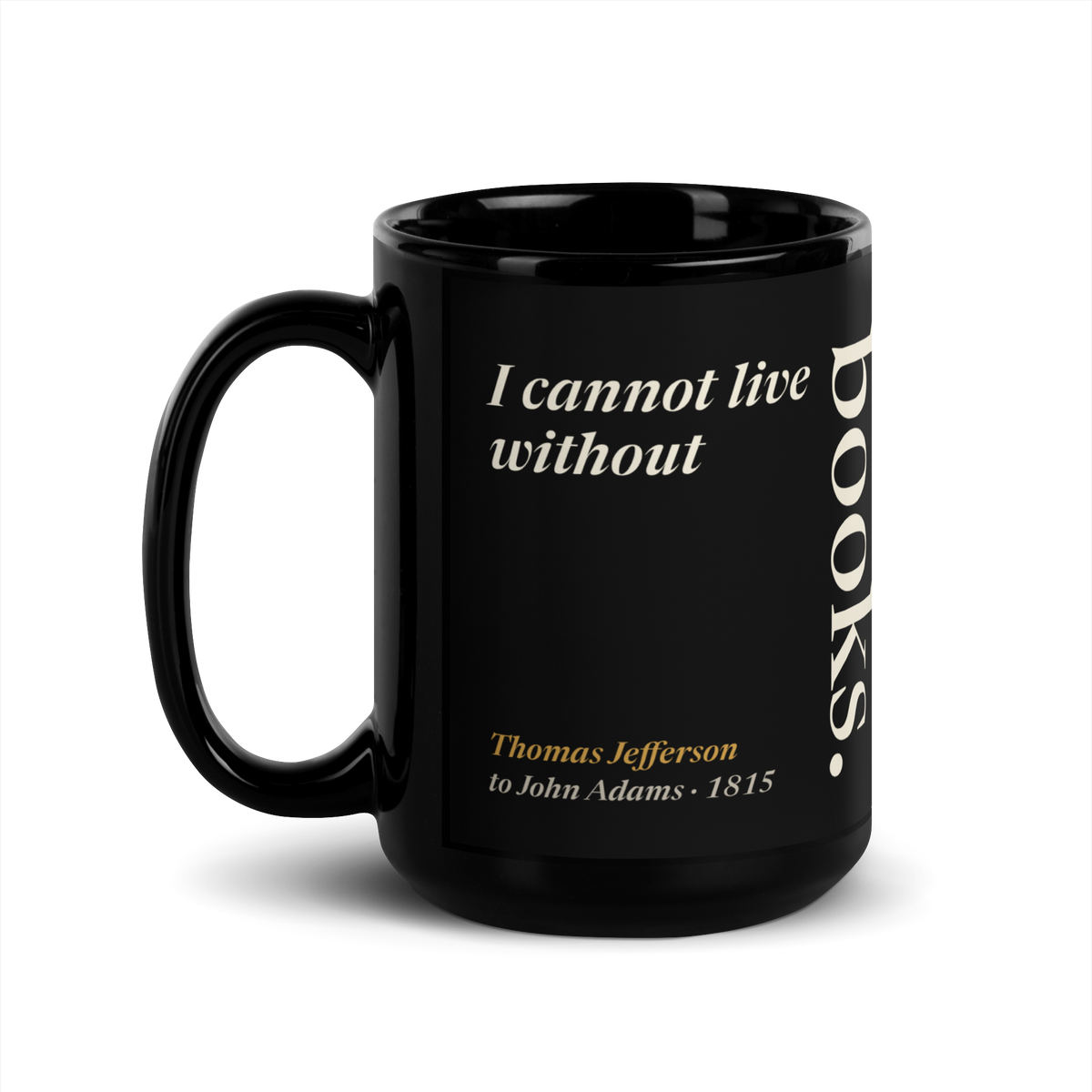 Black mug, handle on the left: "I cannot live without books." Thomas Jefferson, books set upright like a spine.