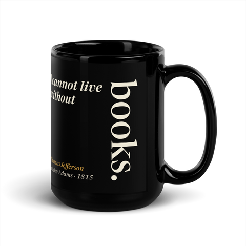 Black mug, handle on the right: "I cannot live without books." Thomas Jefferson, books set upright like a spine.