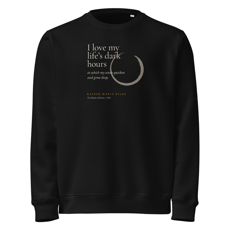 Black sweatshirt, front: “I love my life’s dark hours…” Rainer Maria Rilke, beside a pewter ensō.