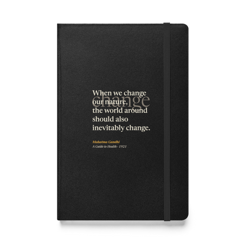 Black hardcover journal, front: “When we change our nature, the world around should also inevitably change.” Gandhi.