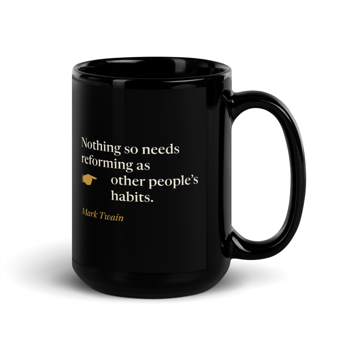 Black mug, handle on the right: "Nothing so needs reforming as other people's habits." Mark Twain, with a pointing hand.