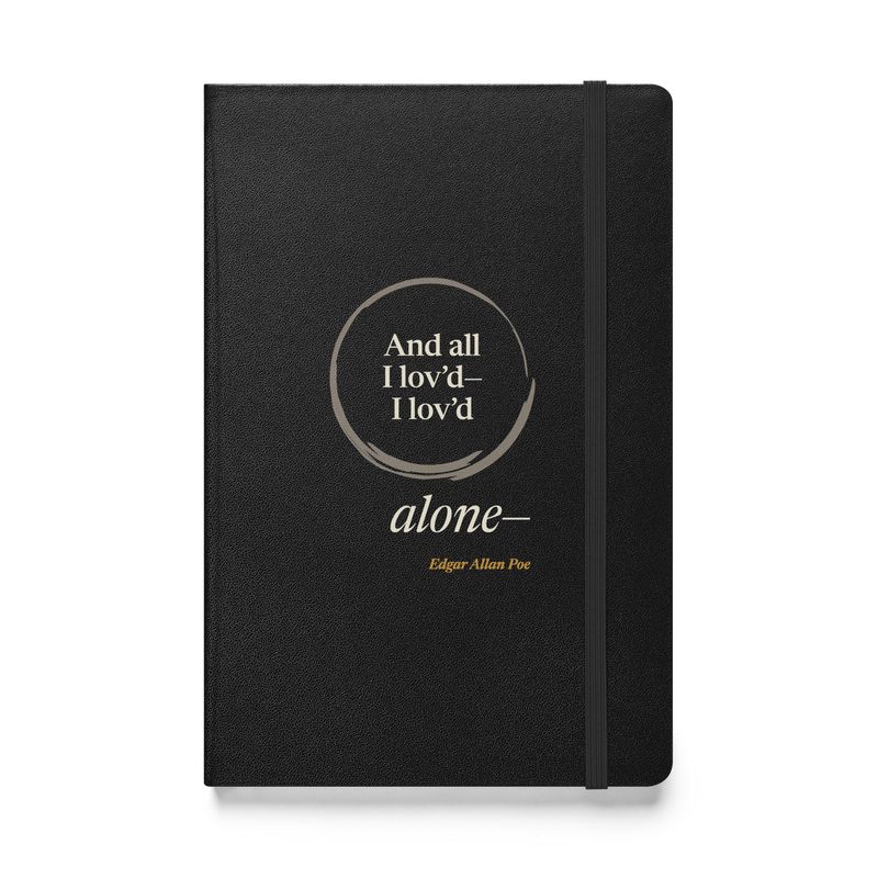 Black hardcover journal, front: "And all I lov'd—I lov'd alone—" Edgar Allan Poe, “alone—” outside an open ensō.