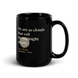Black mug, handle on the right: "We are as clouds that veil the midnight moon;" Percy Shelley, over a pewter moon.