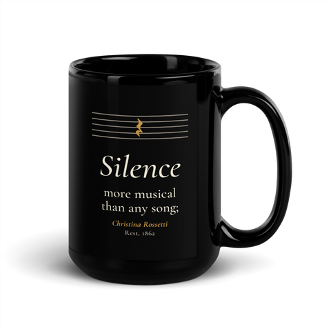Black mug, handle on the right: "Silence more musical than any song;" Christina Rossetti, under an empty music staff.