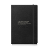 Black hardcover journal, front: “To see a World in a Grain of Sand…” William Blake.