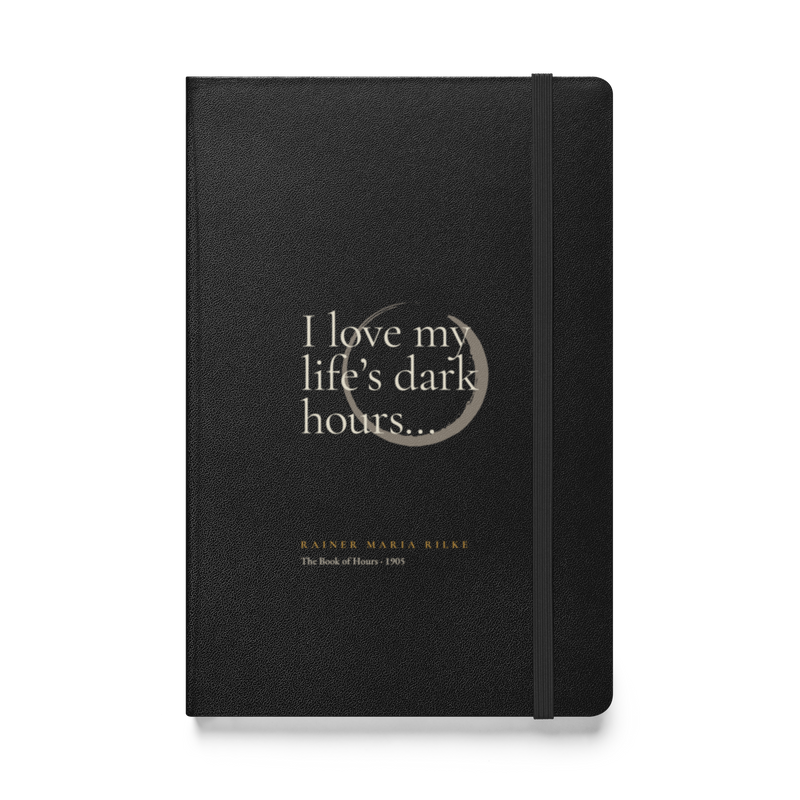 Black hardcover journal, front: “I love my life’s dark hours…” Rainer Maria Rilke, beside a pewter ensō.