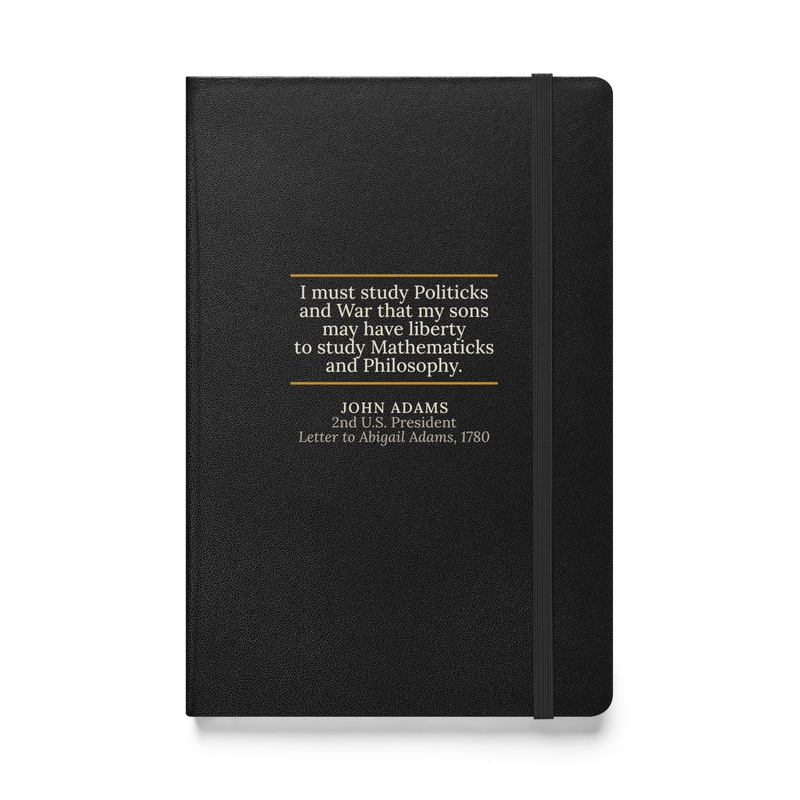 Black hardcover journal, front: “I must study Politicks and War…” John Adams, between two warm rules.