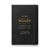 Black hardcover journal, front: “No bird soars too high if he soars with his own wings.” Blake, SOARS in warm matte gold.