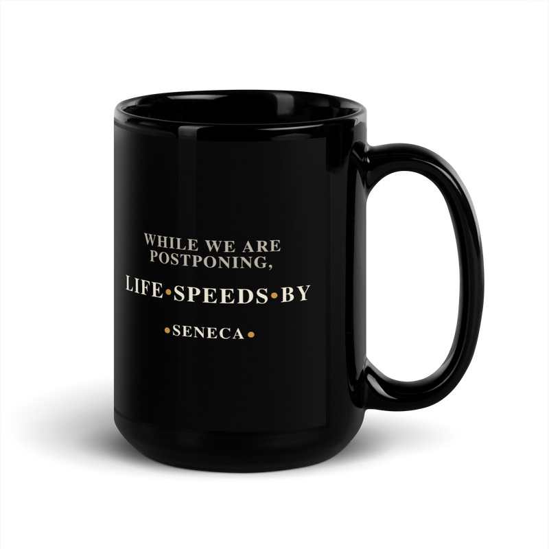 Black mug, handle on the right: “While we are postponing, life speeds by.” Seneca.
