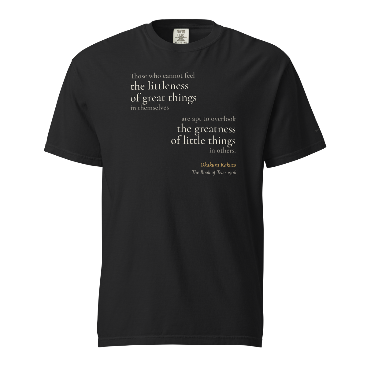 Black t-shirt, front: Okakura's line on "the littleness of great things" and "the greatness of little things," mirrored.