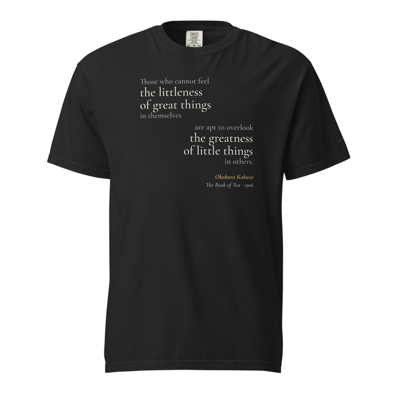 Black t-shirt, front: Okakura's line on "the littleness of great things" and "the greatness of little things," mirrored.
