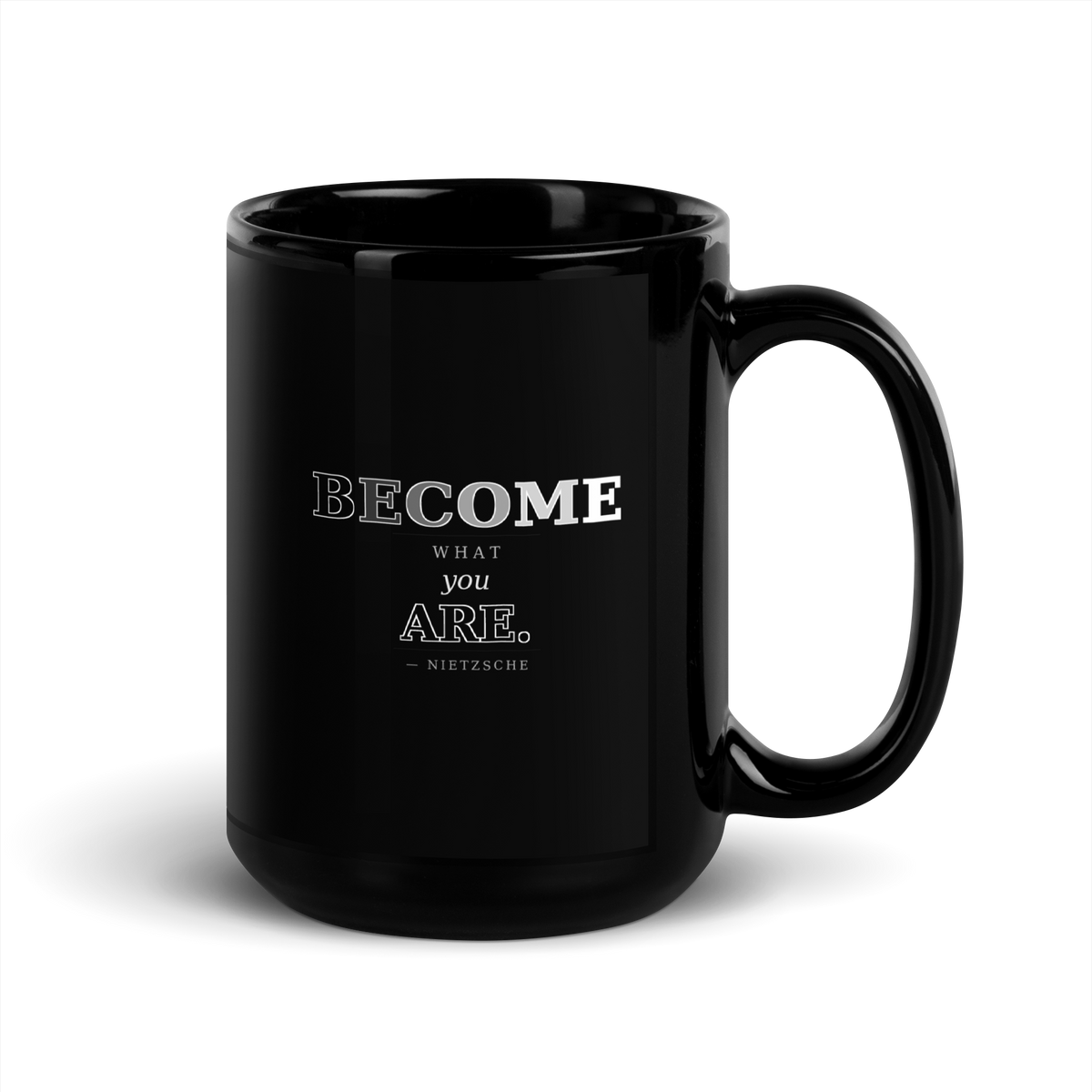 Black mug, handle on the right: “BECOME what you ARE.” Nietzsche.